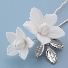 soulshow pins placed in an elegant updo adding delicate floral accents