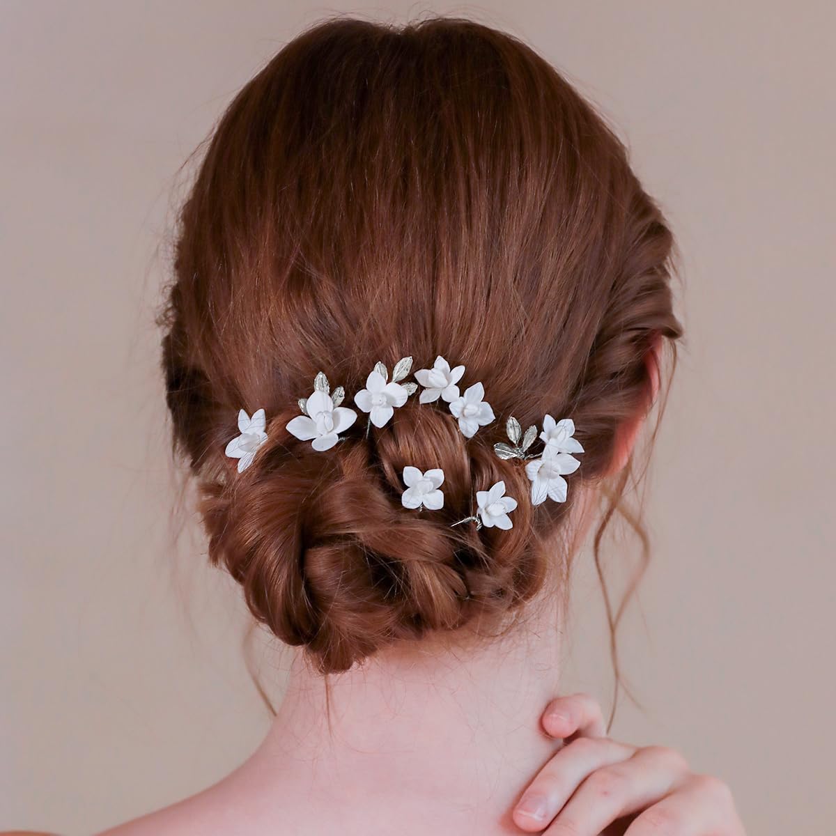 soulshow pins woven through a braid adding romantic highlights to hair