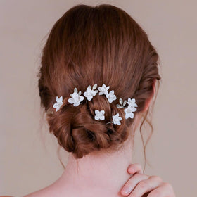 soulshow pins woven through a braid adding romantic highlights to hair