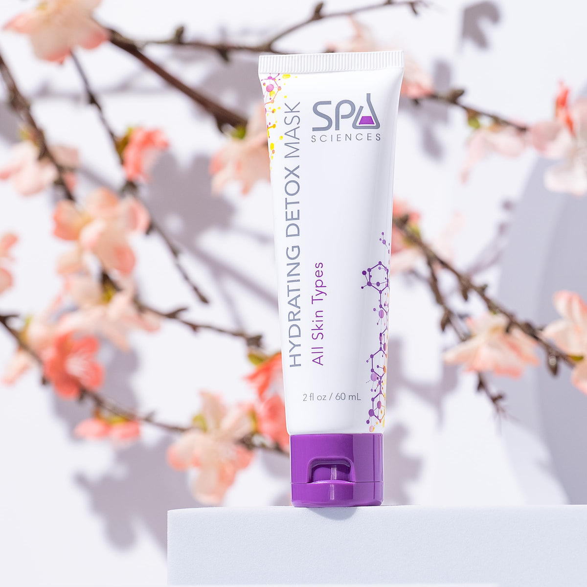 SPA SCIENCES model applying detox mask, demonstrating smooth application