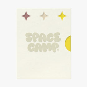 Space Camp Tropical Pineapple tube close-up displaying label and bright fruity appeal