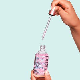 SpaLife bottle held in hand to show size and travel convenience