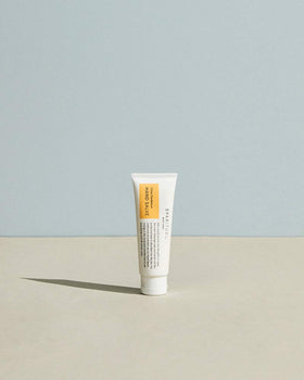 SpaRitual tube being squeezed to dispense salve for precise, no-waste application