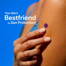 SPOTMYUV sticker on adult arm demonstrating simple use and reassurance