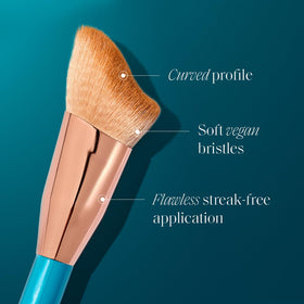 St.Tropez brush applying self-tan to cheek for precise contouring