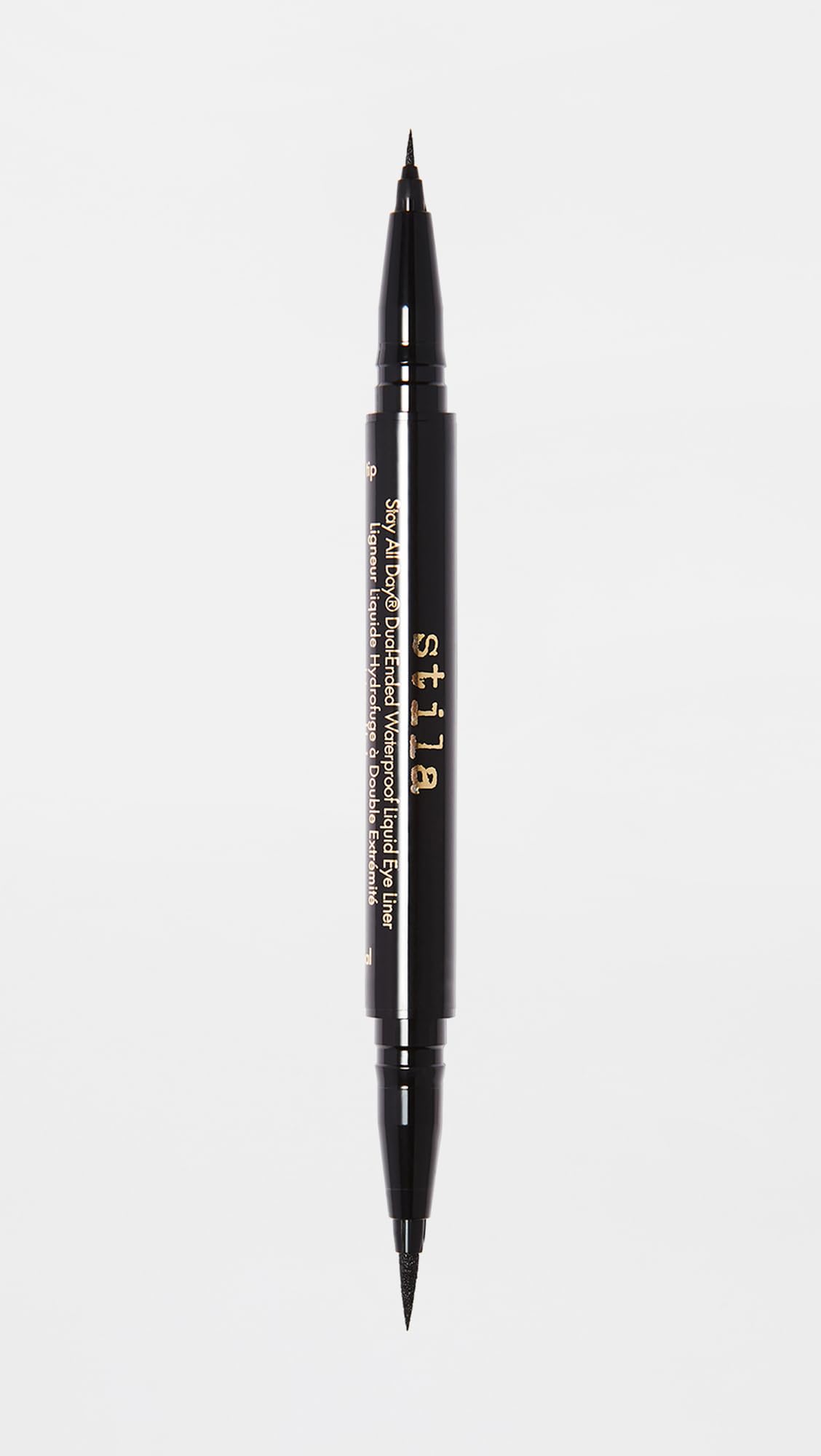 stila liner beside a ruler showing pen size and cap fit for travel-friendly convenience