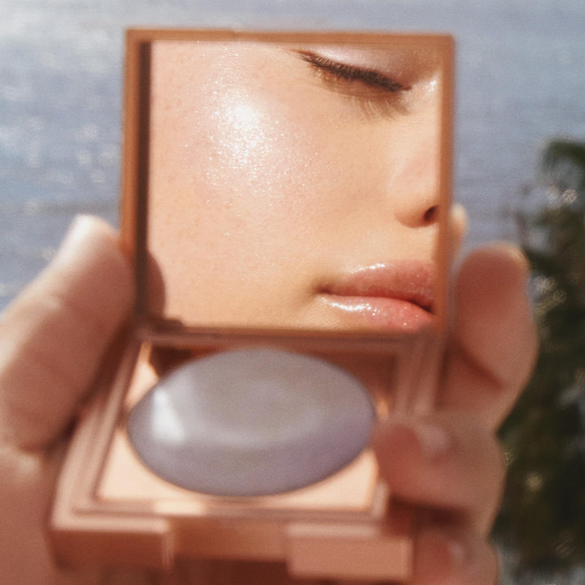 stila lifestyle shot on shoulder demonstrating glistening body highlight