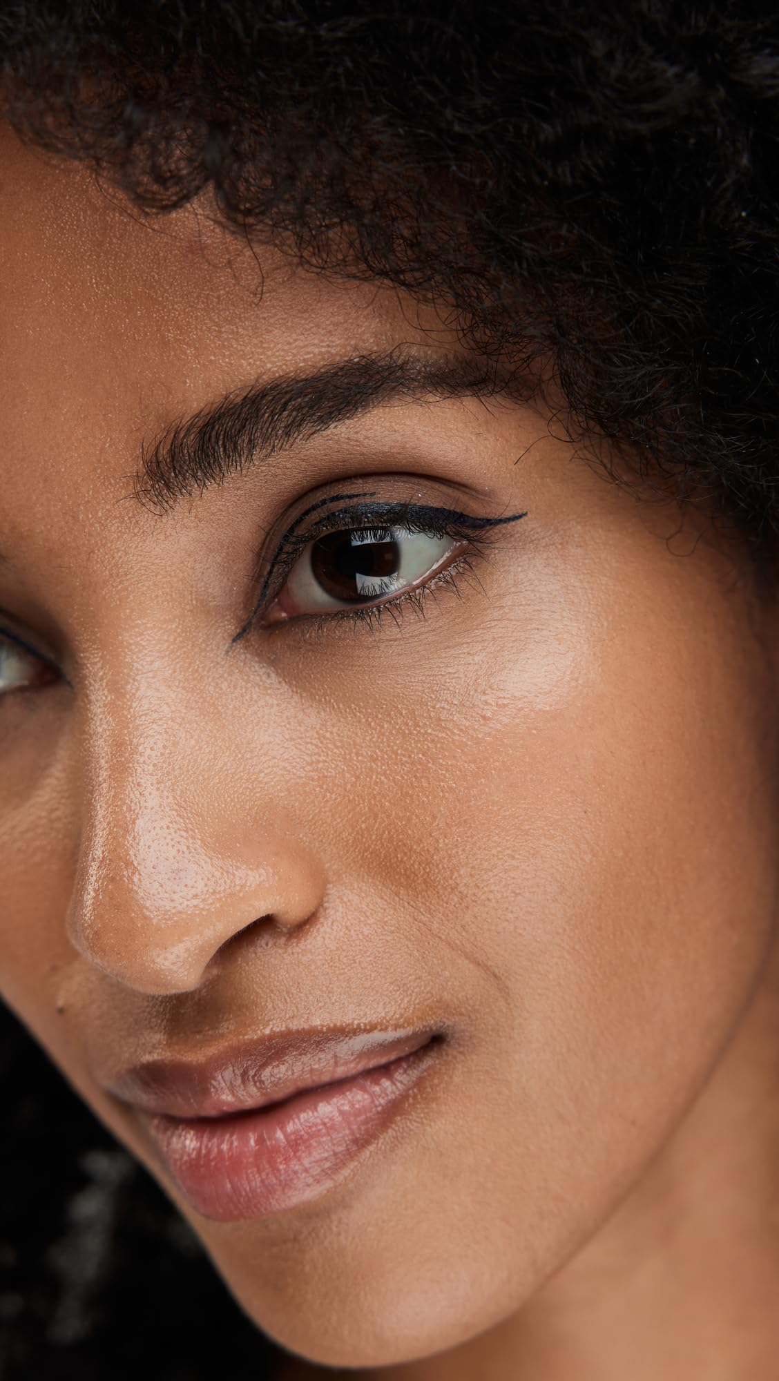 stila swatch on skin showing rich midnight blue pigment and smooth finish