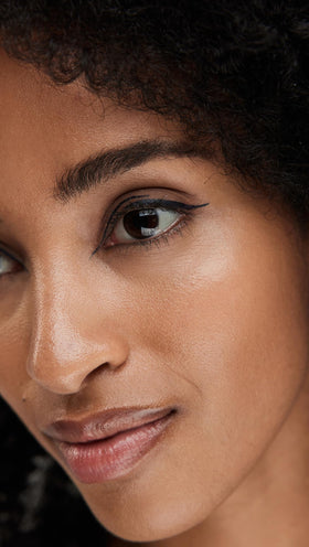 stila swatch on skin showing rich midnight blue pigment and smooth finish