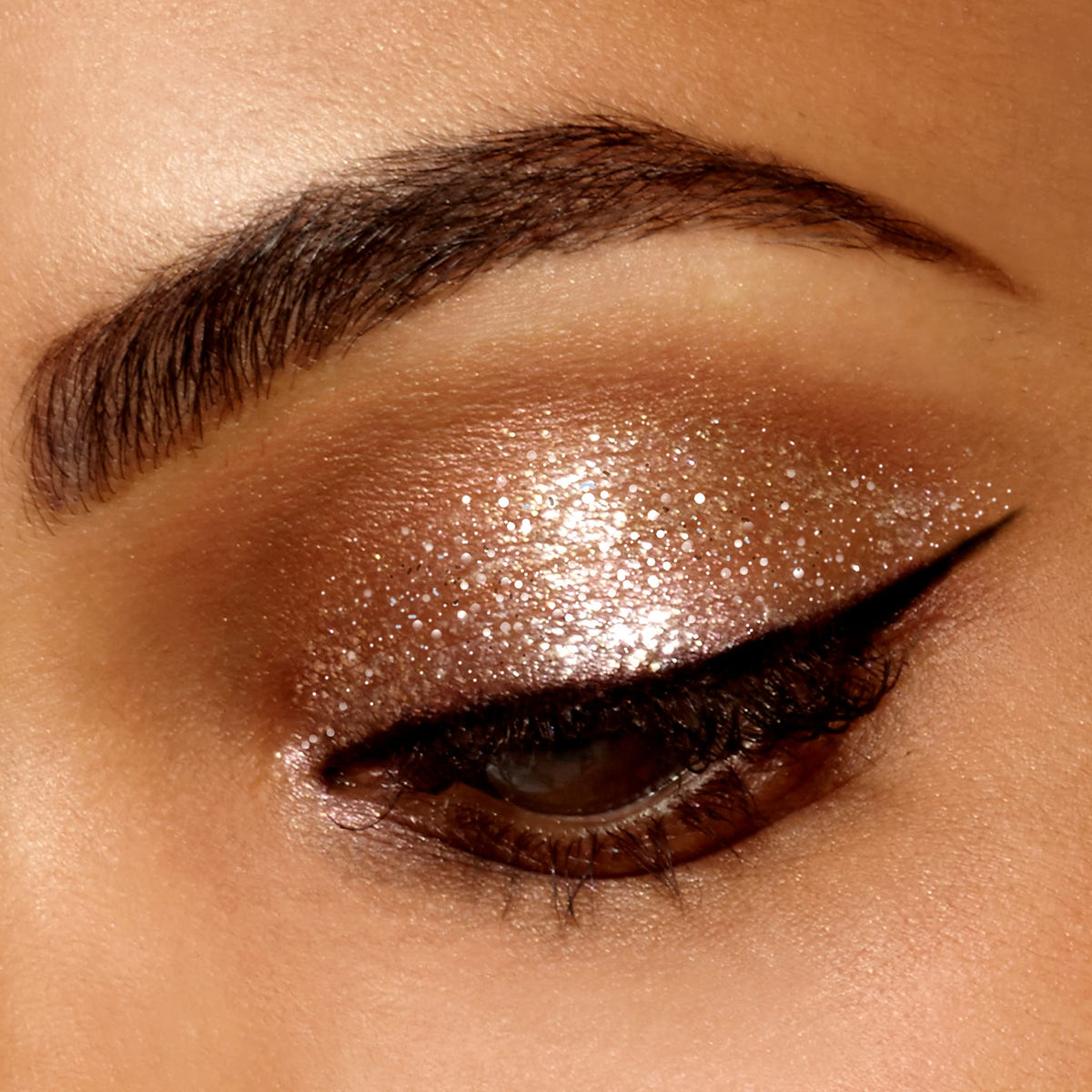 stila mini glitter glow texture on skin showing smooth shimmer and buildable shine