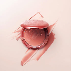 stila size comparison next to hand highlighting travel-friendly benefit