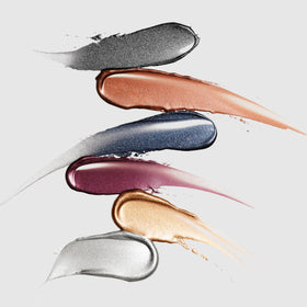stila liner next to a coin showing product size and travel-friendly portability