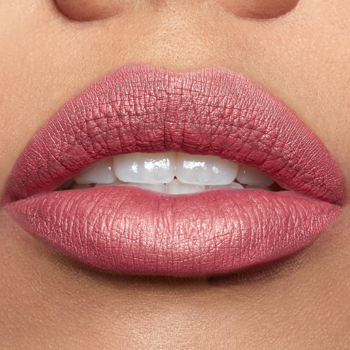 stila lipstick next to common items to show 0.10 oz scale for purchase confidence