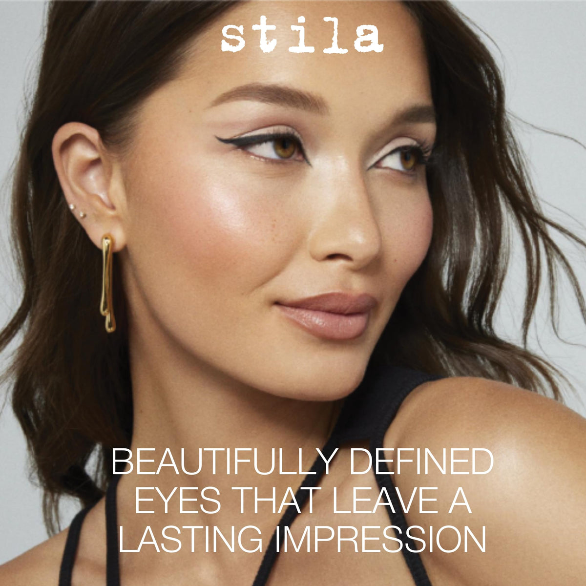 stila ink swipe on skin showing rich intense black pigment and smooth glide