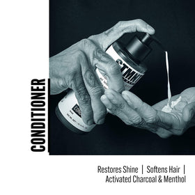 STMNT conditioner close-up label displaying charcoal and menthol ingredients benefit