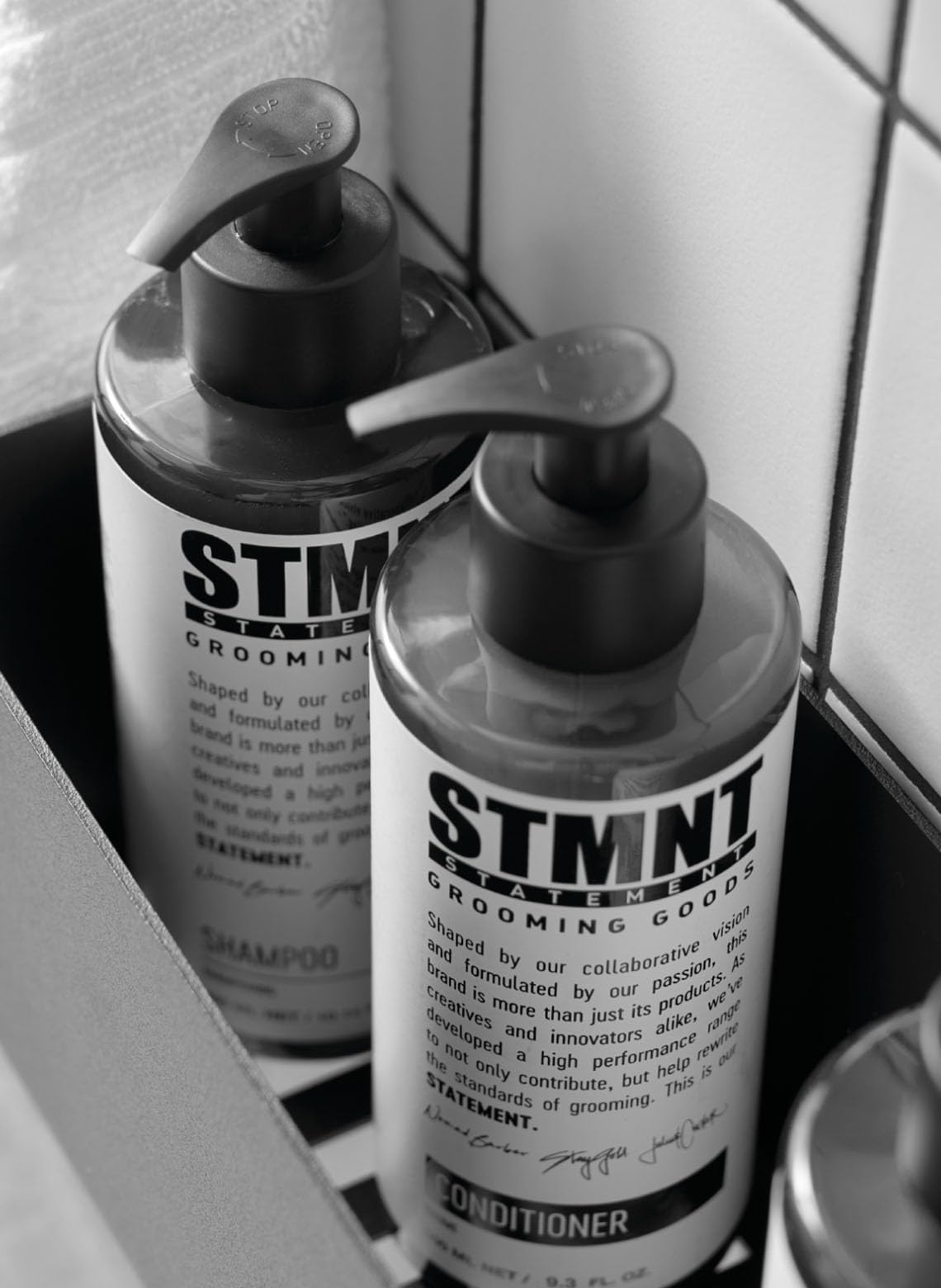 STMNT 10.1 oz bottle next to ruler to show true size and travel-friendly portability