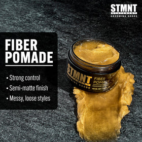STMNT pomade on fingertips showing ease of application and quick styling