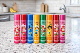 Strawberry Shortcake lip balms styled as gift items showing festive appeal