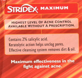 Hand holding a Stridex pad to show size and easy-application benefit
