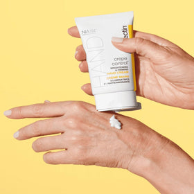 StriVectin hand cream being applied to hands to improve crepey look