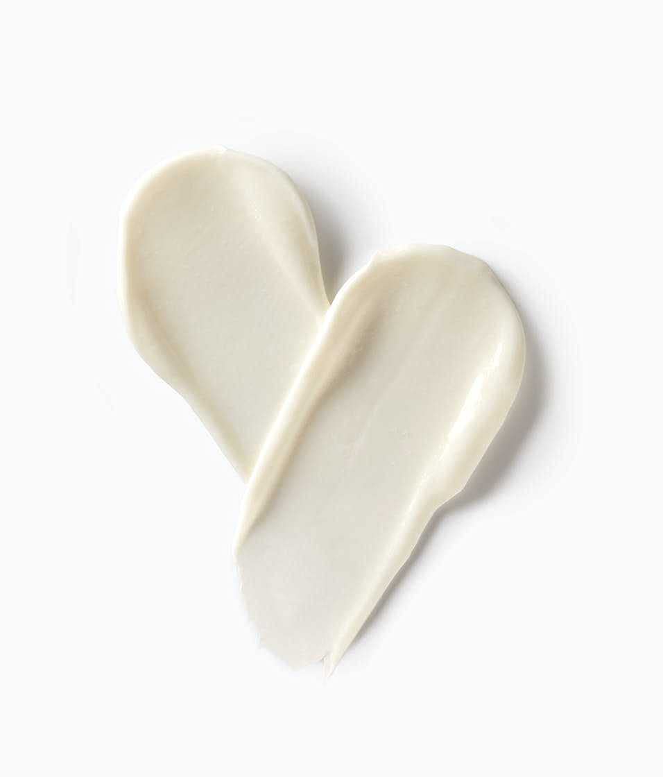 StriVectin open jar with spoon showing creamy consistency for easy application