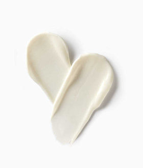 StriVectin open jar with spoon showing creamy consistency for easy application
