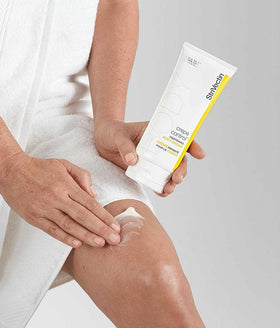 StriVectin held in hand showing 6.7 fl oz size for scale and travel convenience