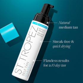 St.Tropez applying mousse with a mitt for streak-free, even coverage