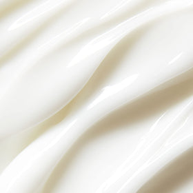 St.Tropez in-use application on arm demonstrating buildable medium-to-dark glow