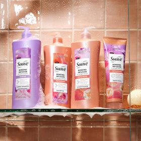 Hand applying Suave conditioner to damp hair for detangling benefit