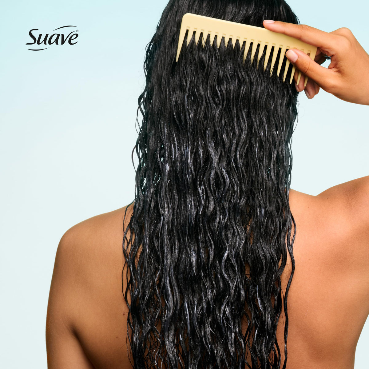 Suave conditioner being applied in shower illustrating smooth detangling action