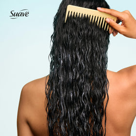 Suave conditioner being applied in shower illustrating smooth detangling action