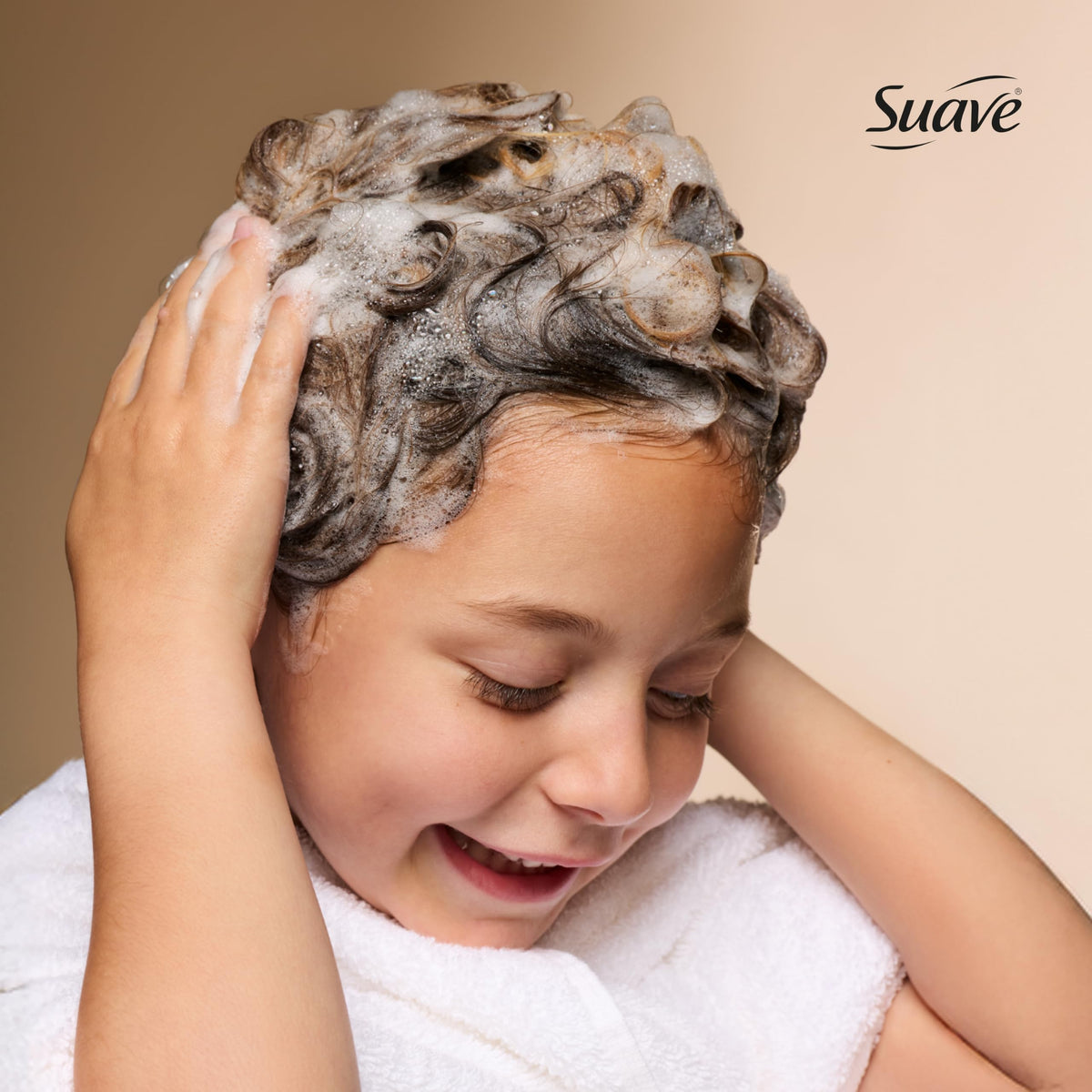 Suave Enchanted Berry creamy texture on palm for gentle lather demonstration