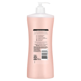 Suave Hydra Gloss bottle staged on bathroom shelf for daily use