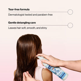 Suave nozzle close-up spraying fine mist for even coverage and easier combing