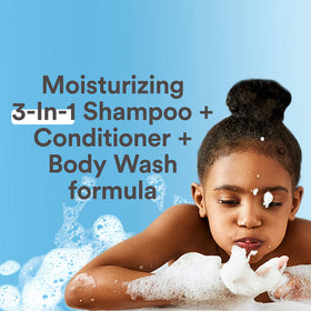 Suave Kids creamy lather on hands showing gentle suds and mild texture