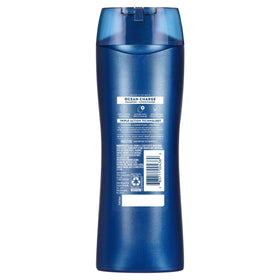 Suave bottle held in hand showing 12.6 fl oz scale and travel-ready benefit