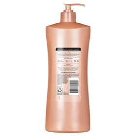 Suave micellar infusion in shower setting being applied to wet hair for quick daily routine