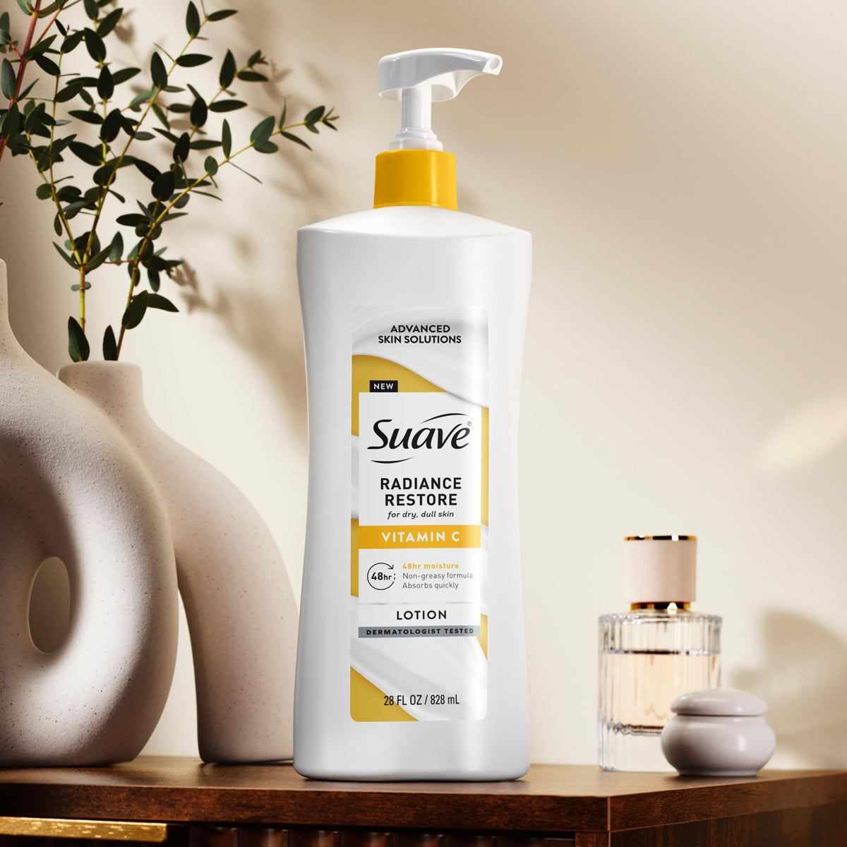 suave bottle beside a ruler to show 28 fl oz size benefit