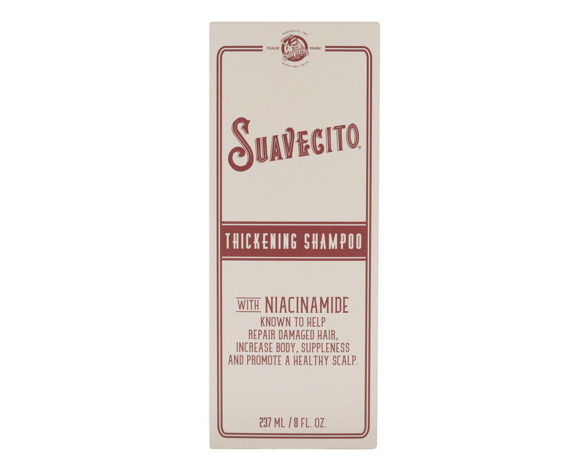 Suavecito set on bathroom shelf next to styling tools showing fuller-look hair routine benefit