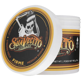 Suavecito tub in hand to show 32 oz size and value benefit