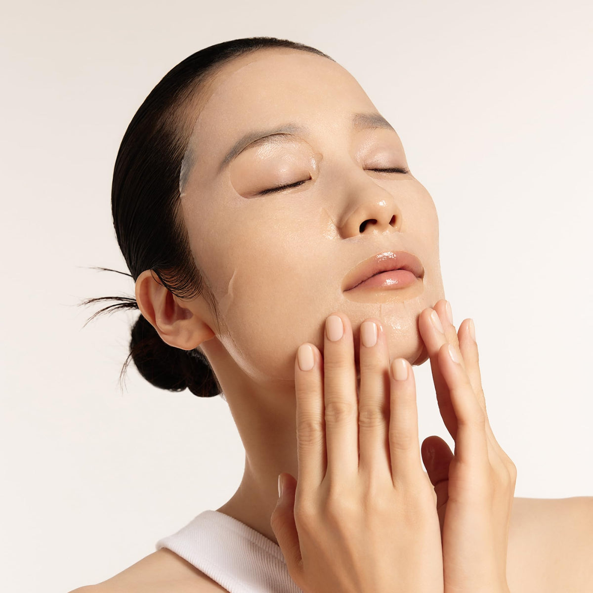 Sulwhasoo sheet mask applied on face showing cooling hydration effect