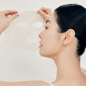 Sulwhasoo serum drops beside ginseng root illustrating potent ingredients and concentrated hydration