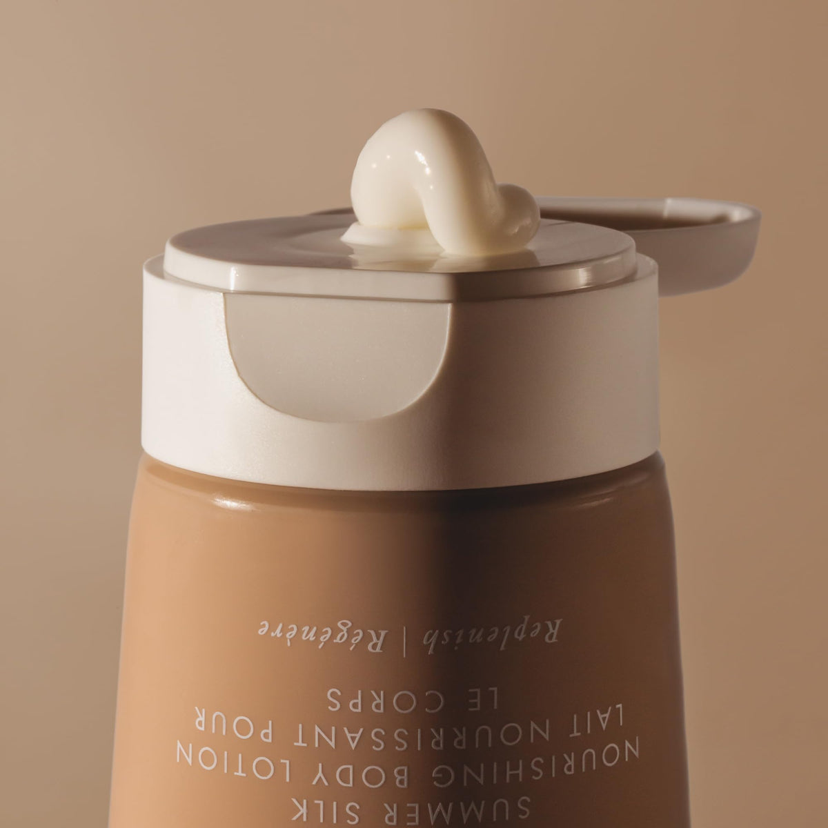 Summer Fridays applying lotion to arm illustrates smooth, non-greasy hydration benefit