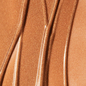 Summer Fridays bronzing drops applied on cheek, shows natural sun-kissed finish and blendability