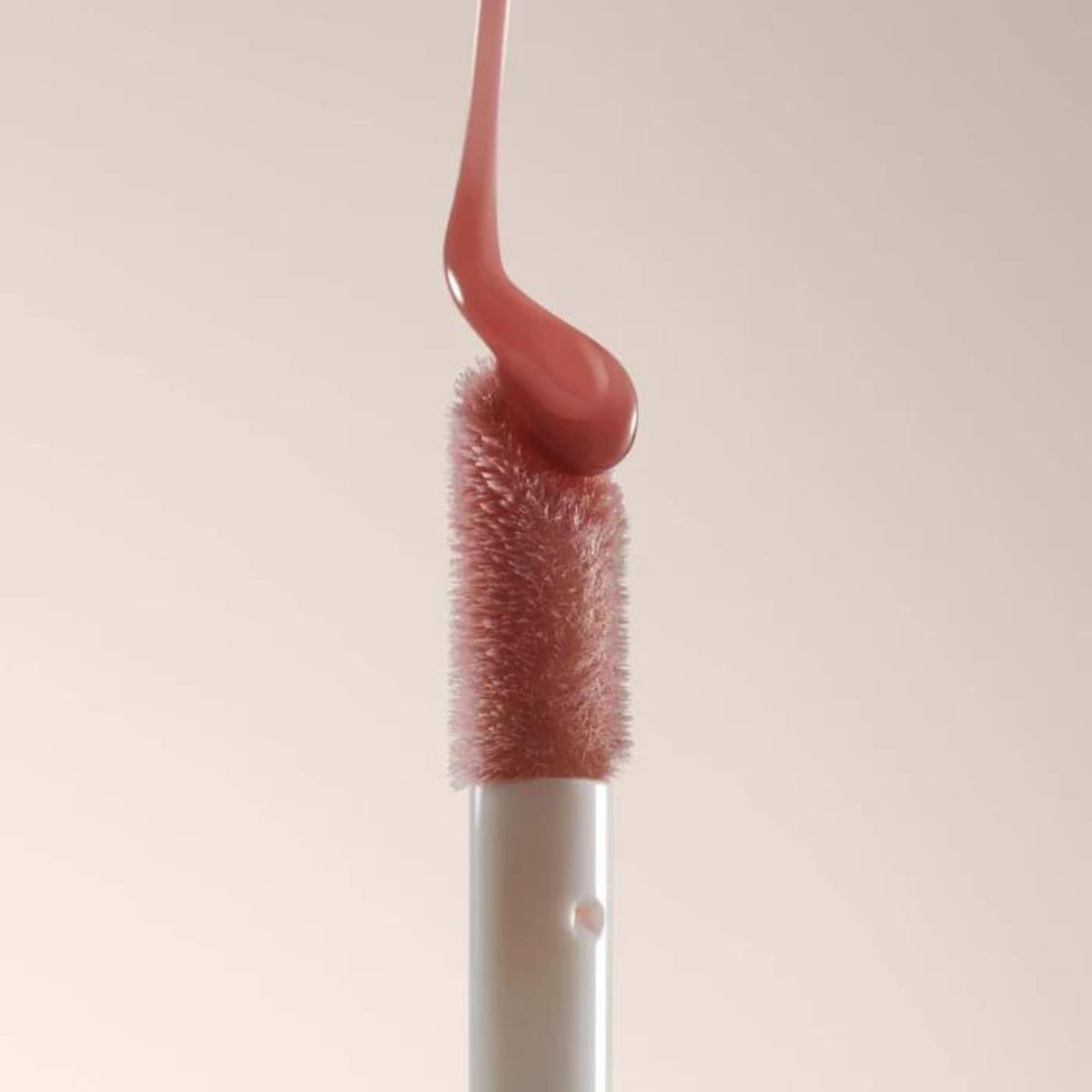 Summer Fridays lip oil staged with makeup showing layering over lipstick benefit