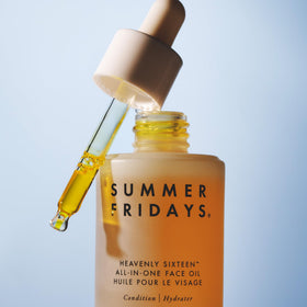Summer Fridays bottle displayed near plant ingredients, communicates nourishing botanical blend