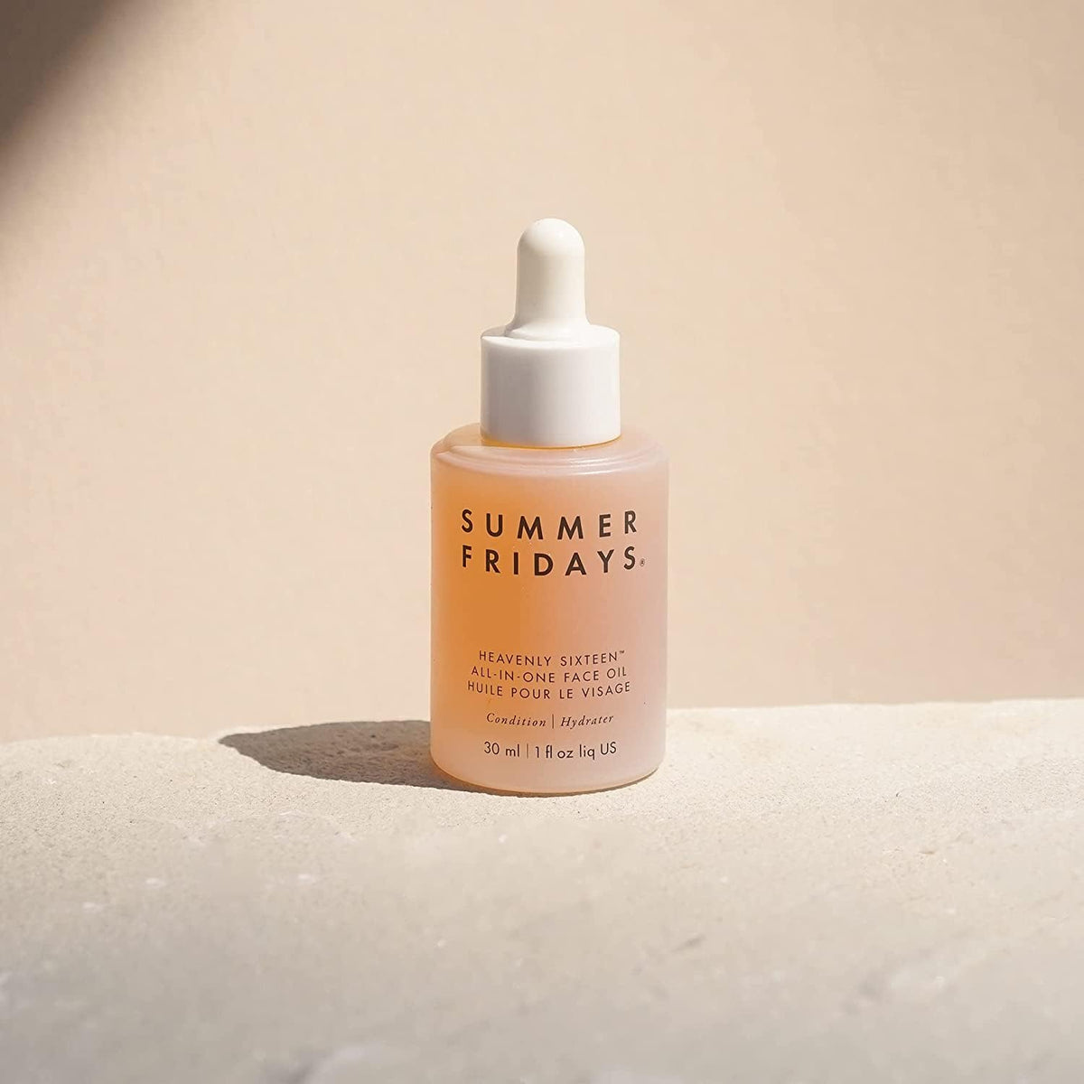 Summer Fridays dropper releasing oil, shows lightweight texture and easy application benefit