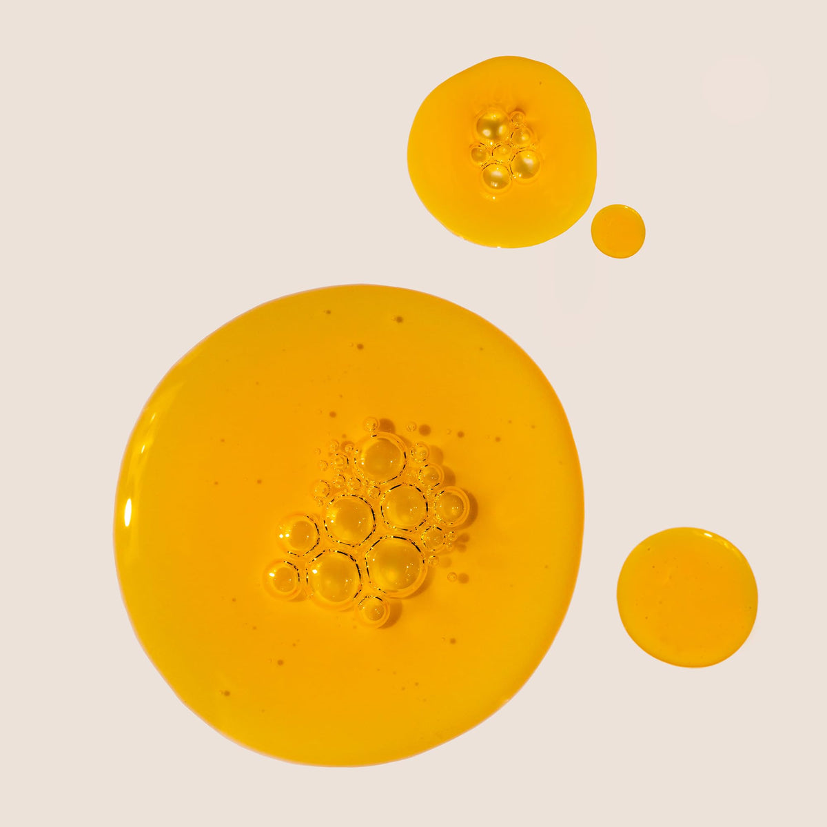 Summer Fridays oil on fingertips close-up, demonstrates smooth absorbent texture for hydration
