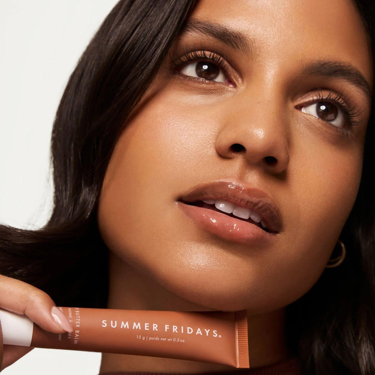 Summer Fridays swiped Iced Coffee on lips showing sheer cocoa tint and natural enhancement